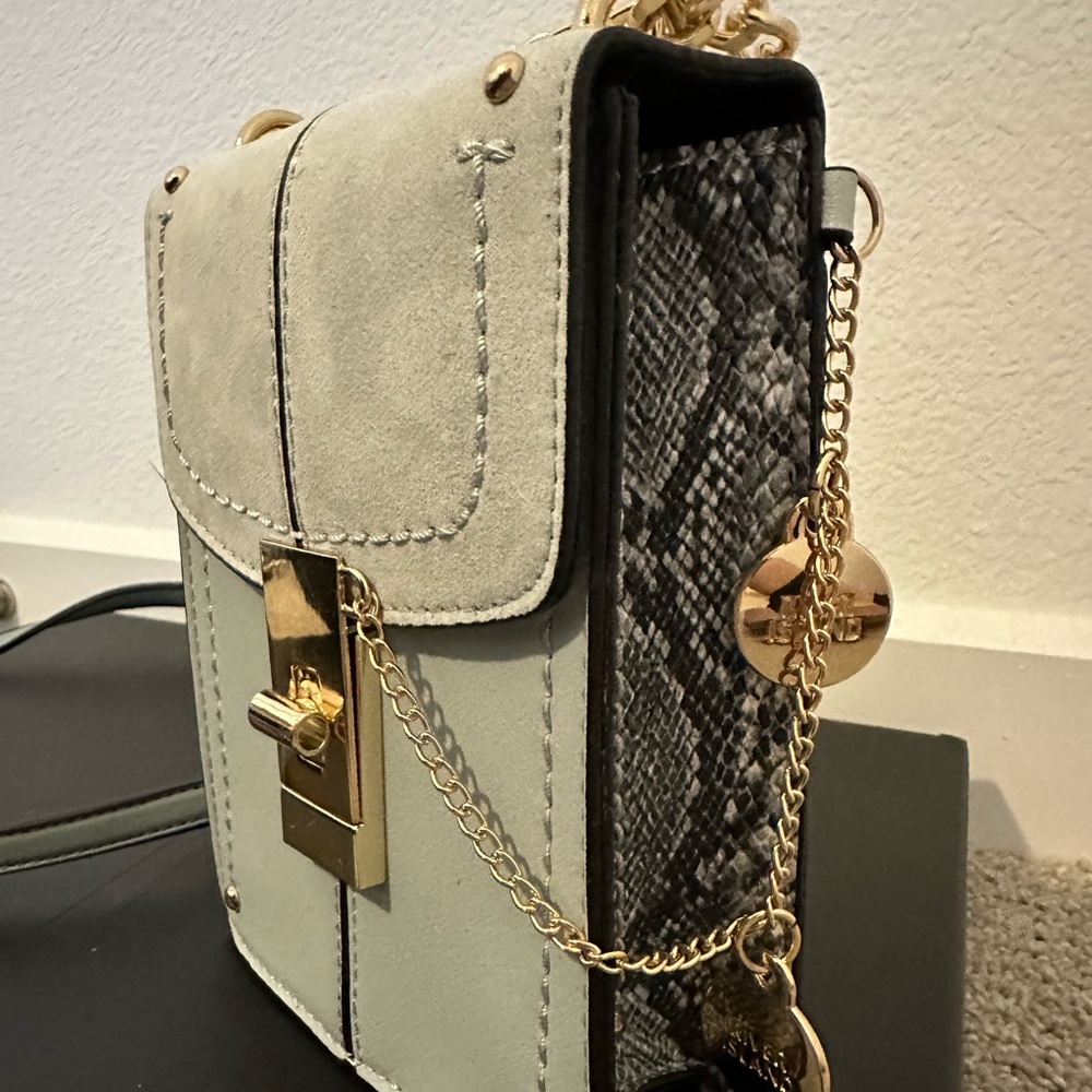 Small light blue suede phone bag